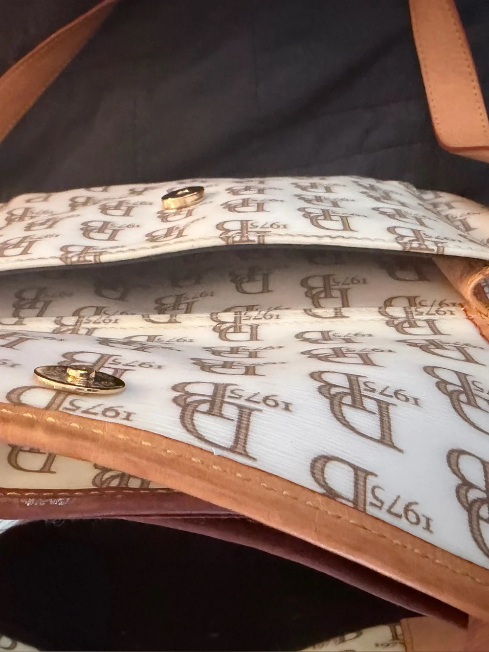 Dooney & Burke Monogram Leather Baby Bag in Cream and Tan